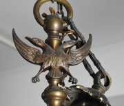 Araa holandesa, de bronce, 10 brazos con portavelas. Electrificacin externa. Aguila bicfala superior. Alto 85 cm.
